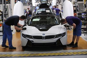 BMW ratchets up cuts as operating profit falls