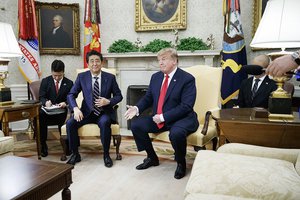 Trump pressed Japan's Abe to build more vehicles in the U.S.