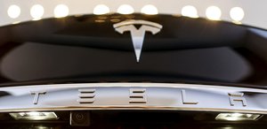 Tesla closes on $2.7 billion mixed offering of shares, debt